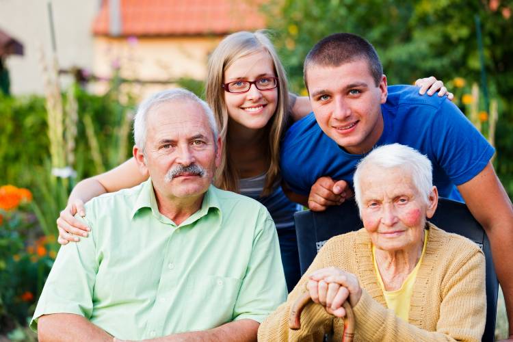 Family carers relaxing with their older relatives, supported by respite care in Kent